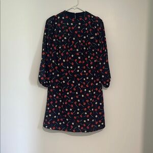 Chic Black Dress with Red and Cream Pattern